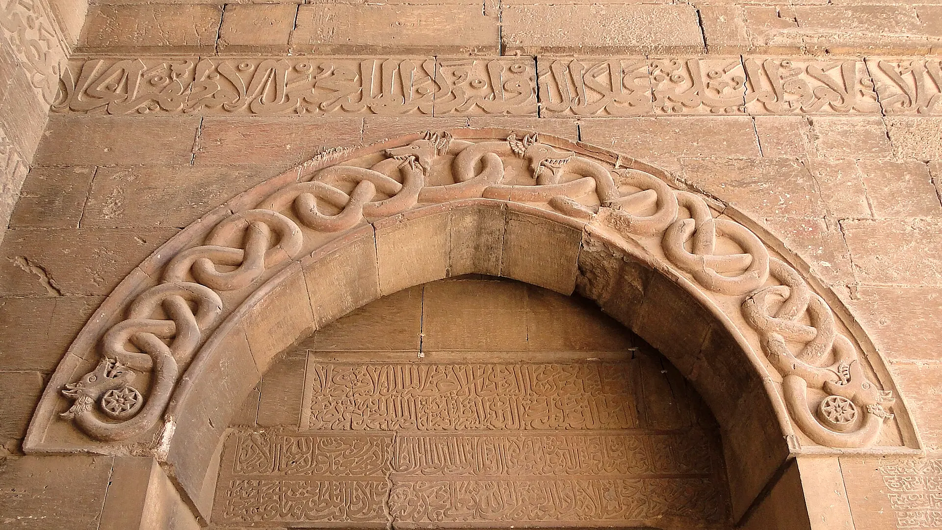 Carved stone and inscription over a doorway in the entrance